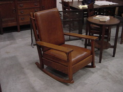 Stickley Brothers lamp table shown with large Gustav Stickley rocker.